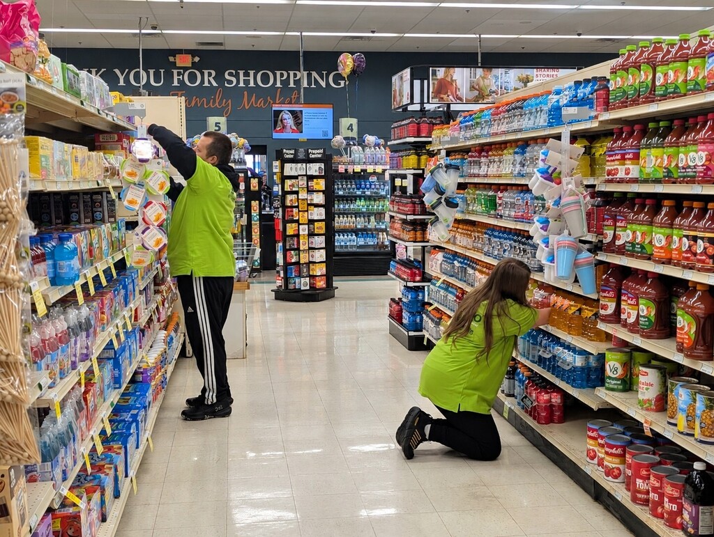 Students Stocking Shelves at Neiman's Market