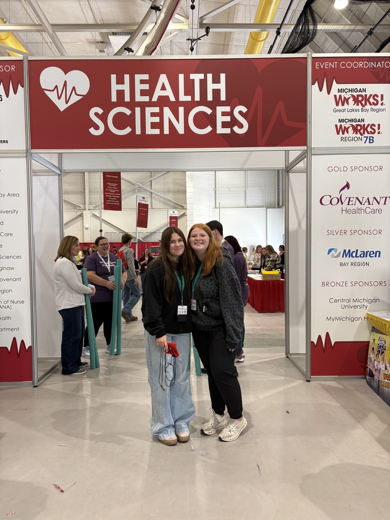 Students Posing Under Health Science Sign