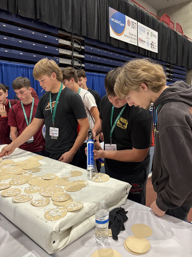 Students testing out caulking