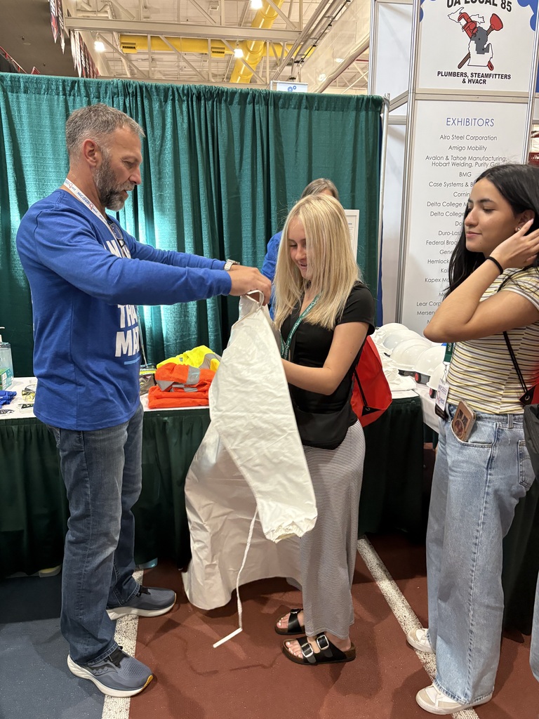 Student Trying on Lab Coat