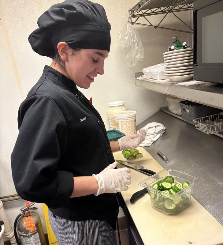 girl working with cucumbers