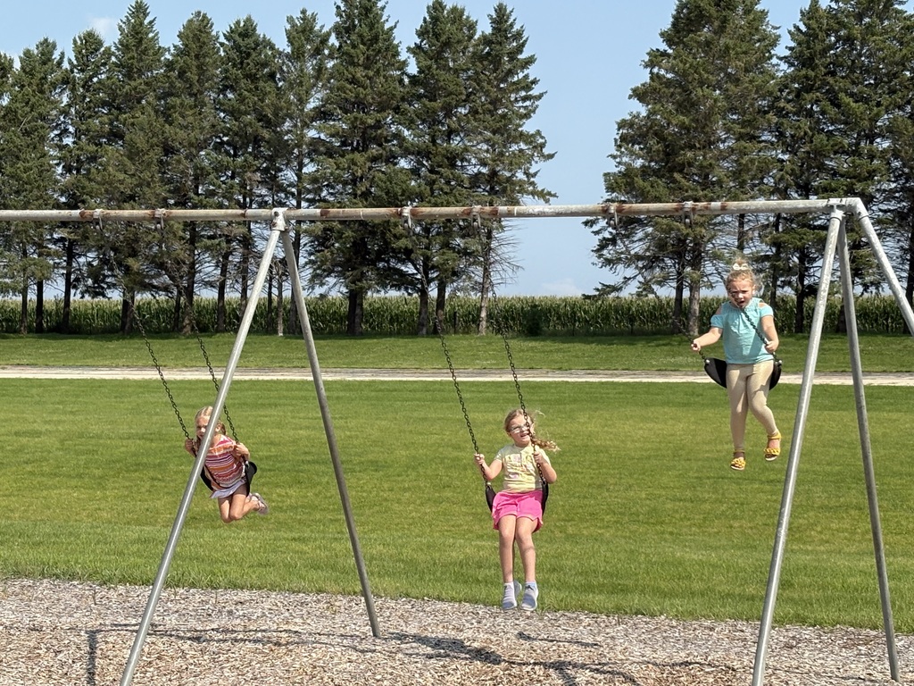 2 girls swinging