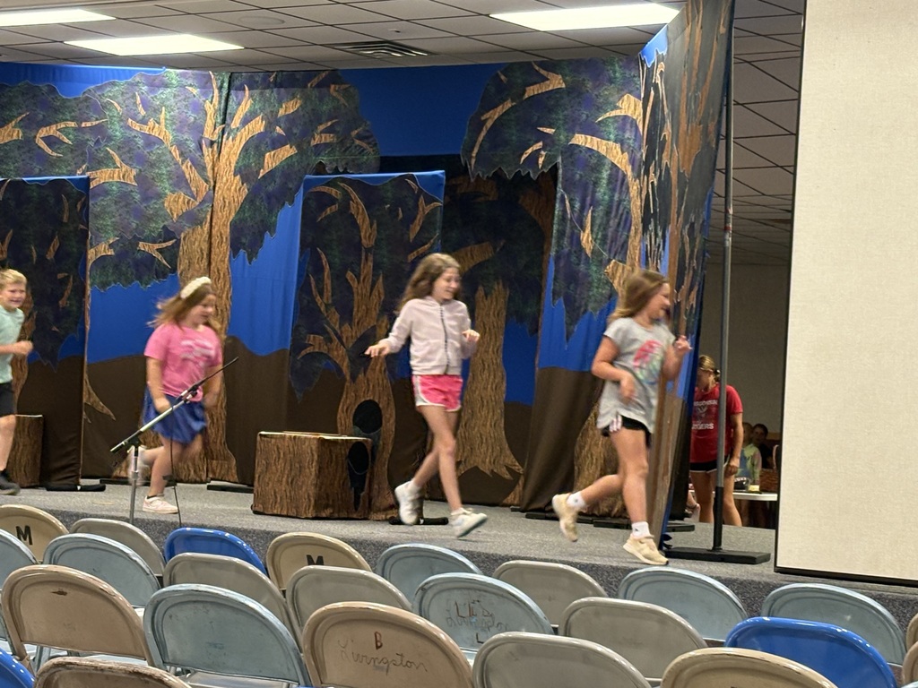 students running across the stage 