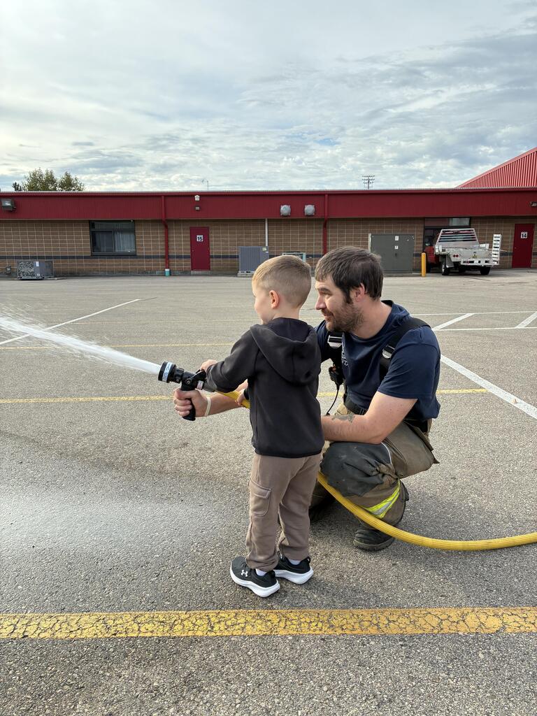 Student Testing out the Hose