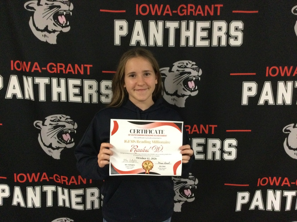 Girl holding a Reading Millionaire Certificate