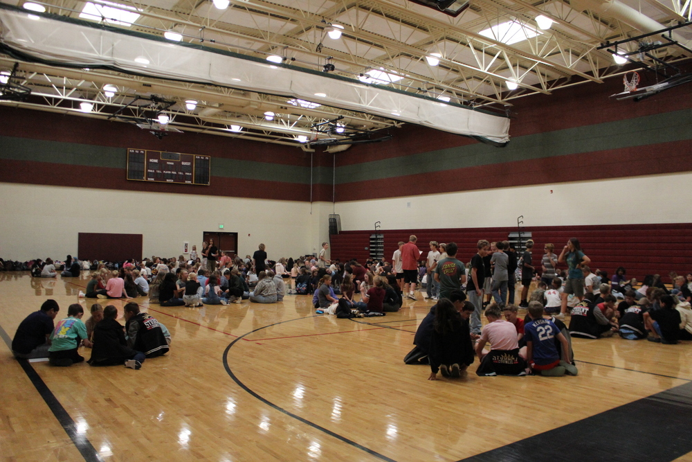 students sitting in the gym