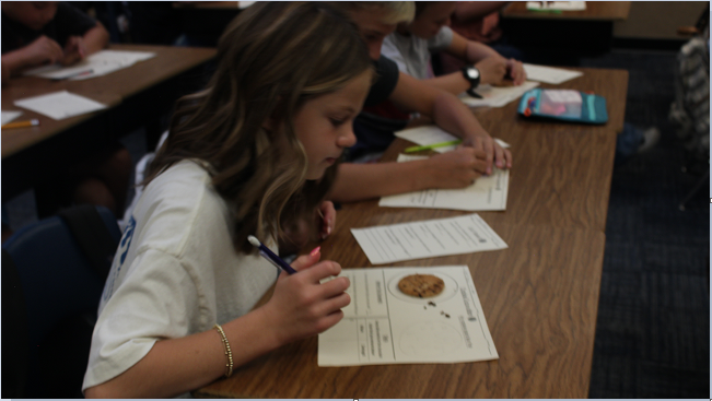 students practicing cookie archeology