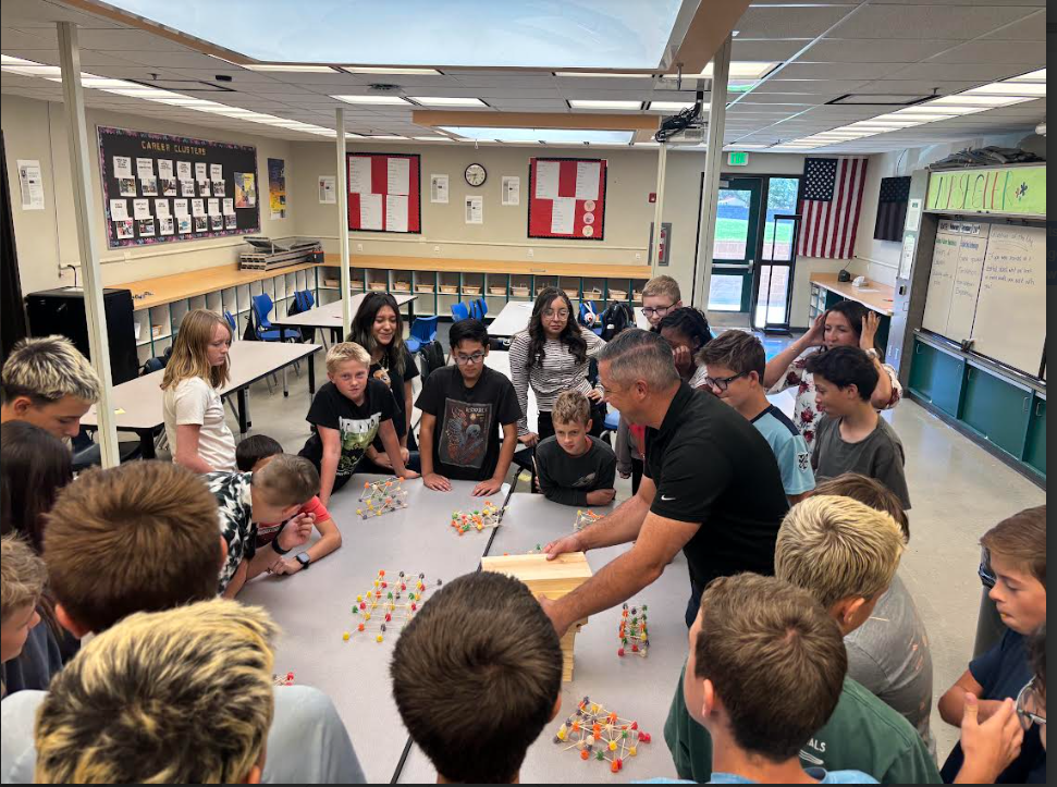 pic of Tim Watson helping students
