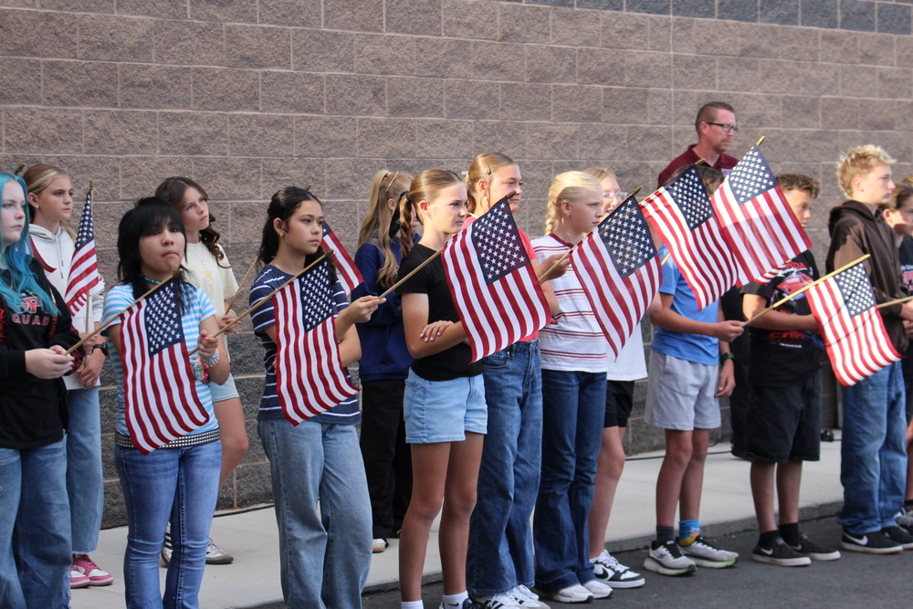 students holding flags