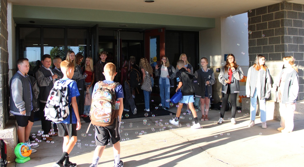 student walking into a school