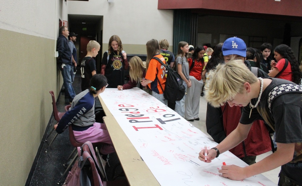  students signing a pledge