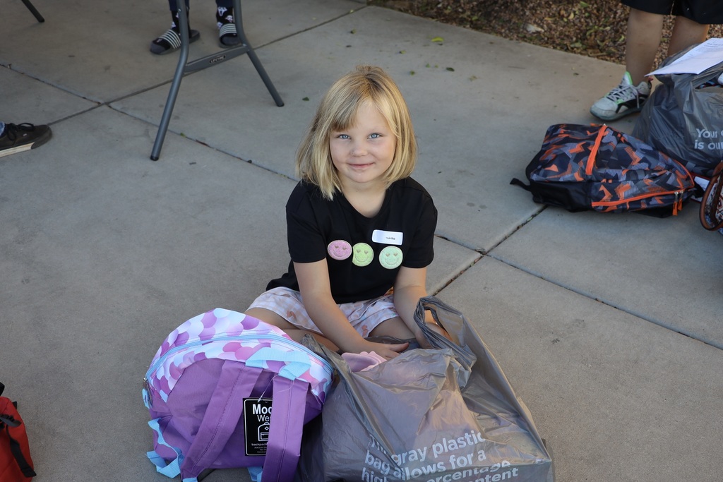 A student waits after purchasing her items.