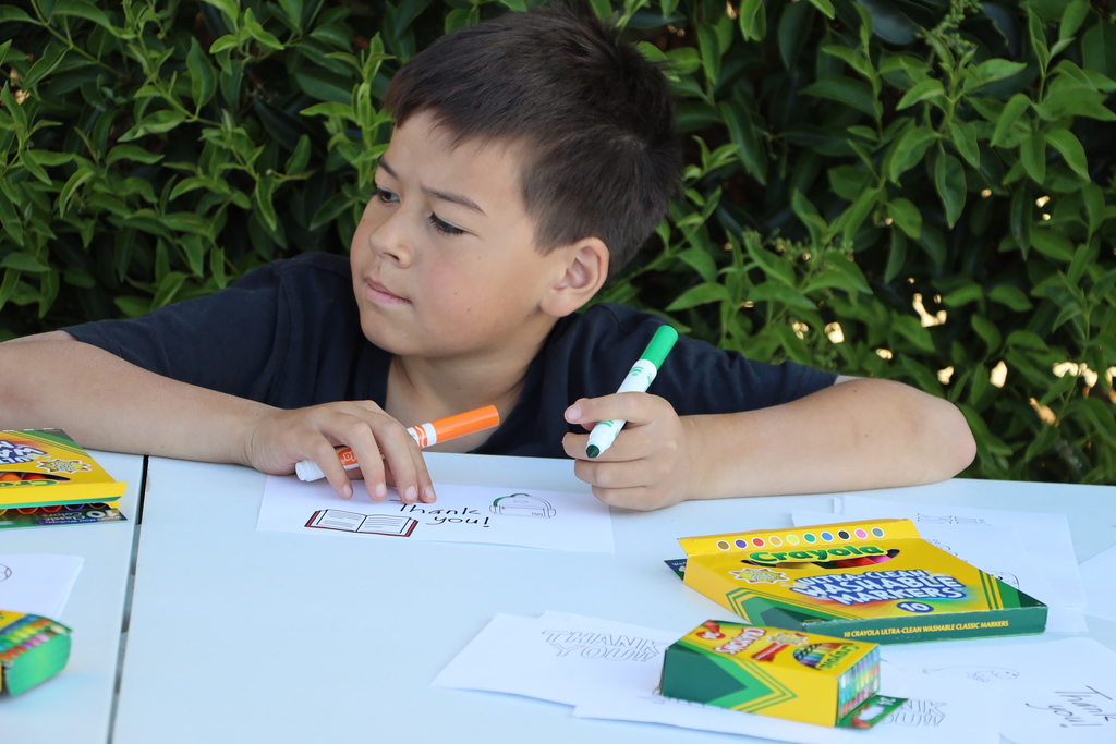 A student writes a thank you note.