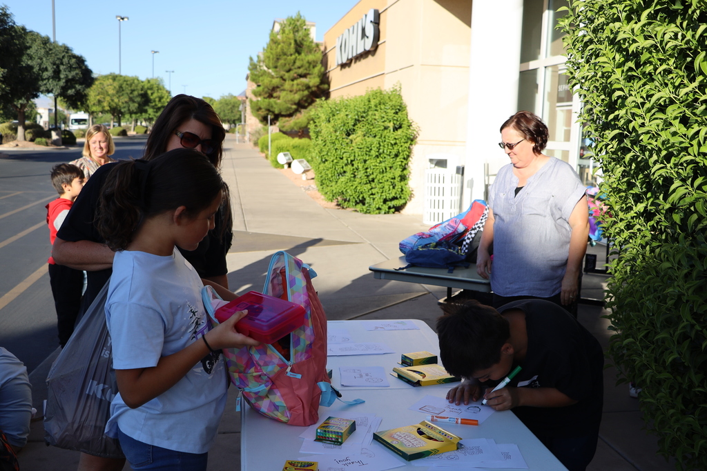 A student picks out a backpack.