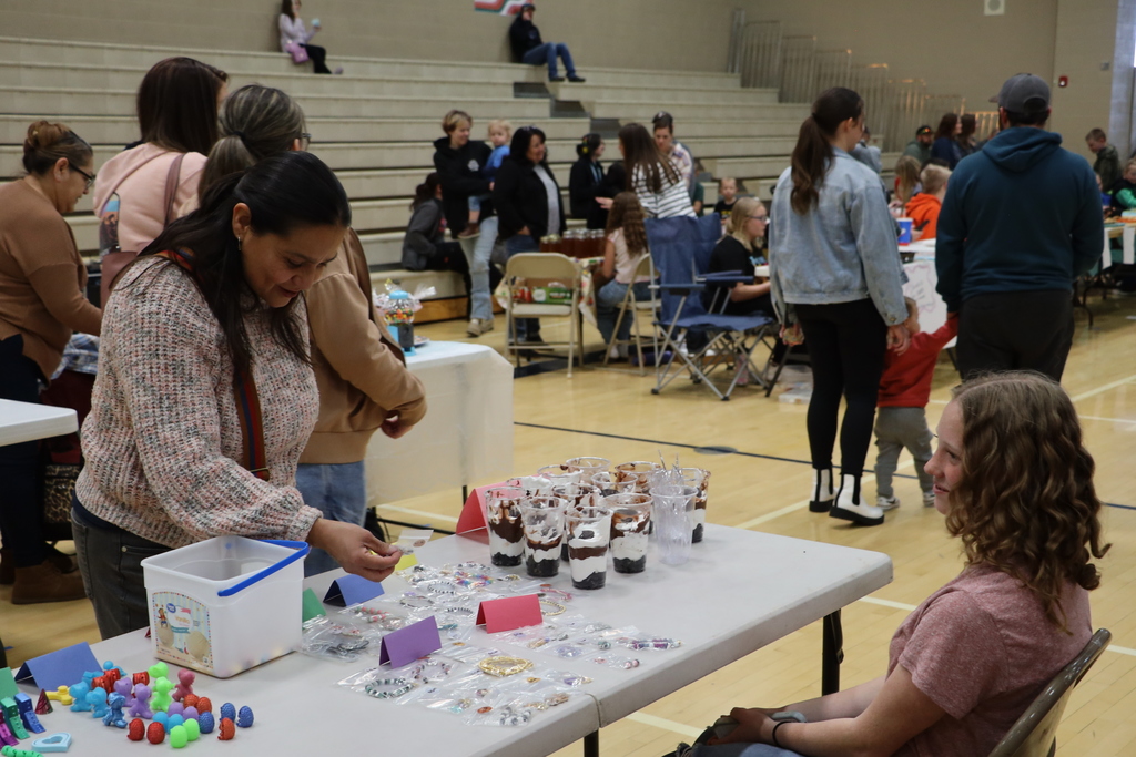 A community member tries to decide what to buy.