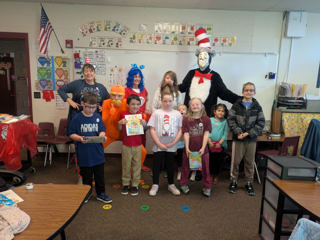 Students show off their free book.