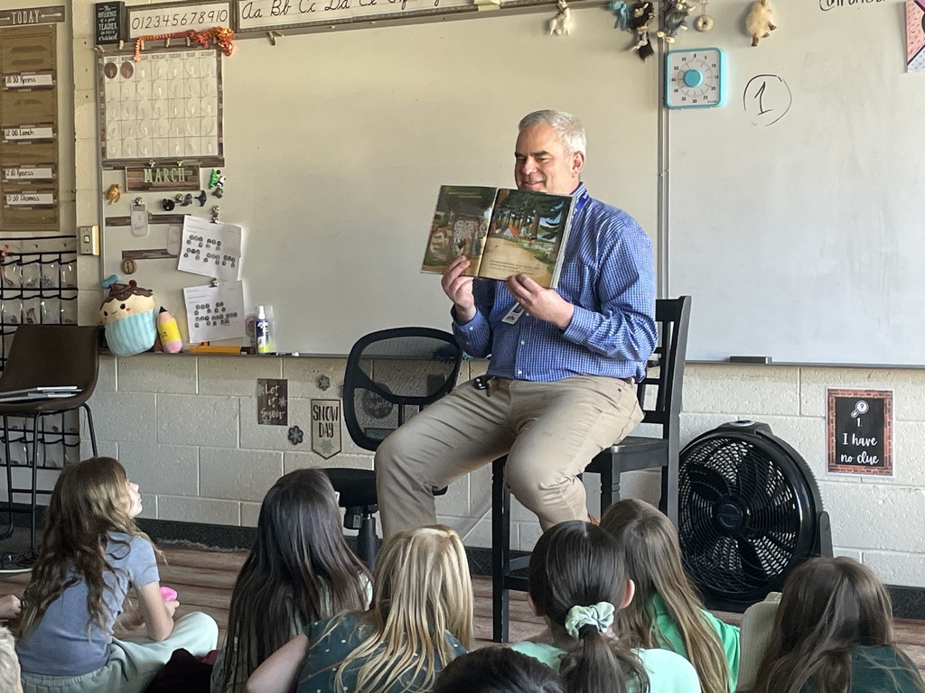 East Principal Mike Moyle reads to students.