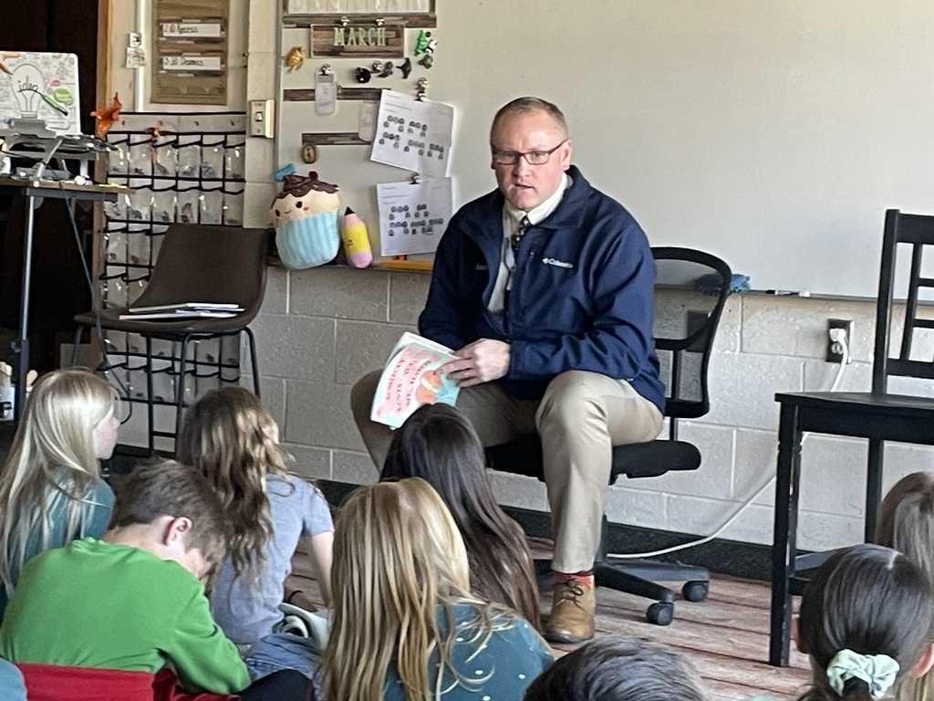Superintendent Dr. Lance Hatch reads to students.