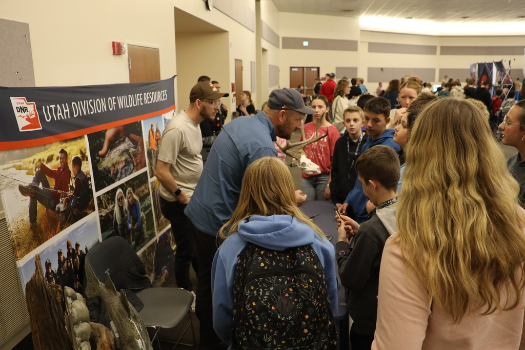 The Utah Division of Wildlife Resources representatives speak with students about their careers.