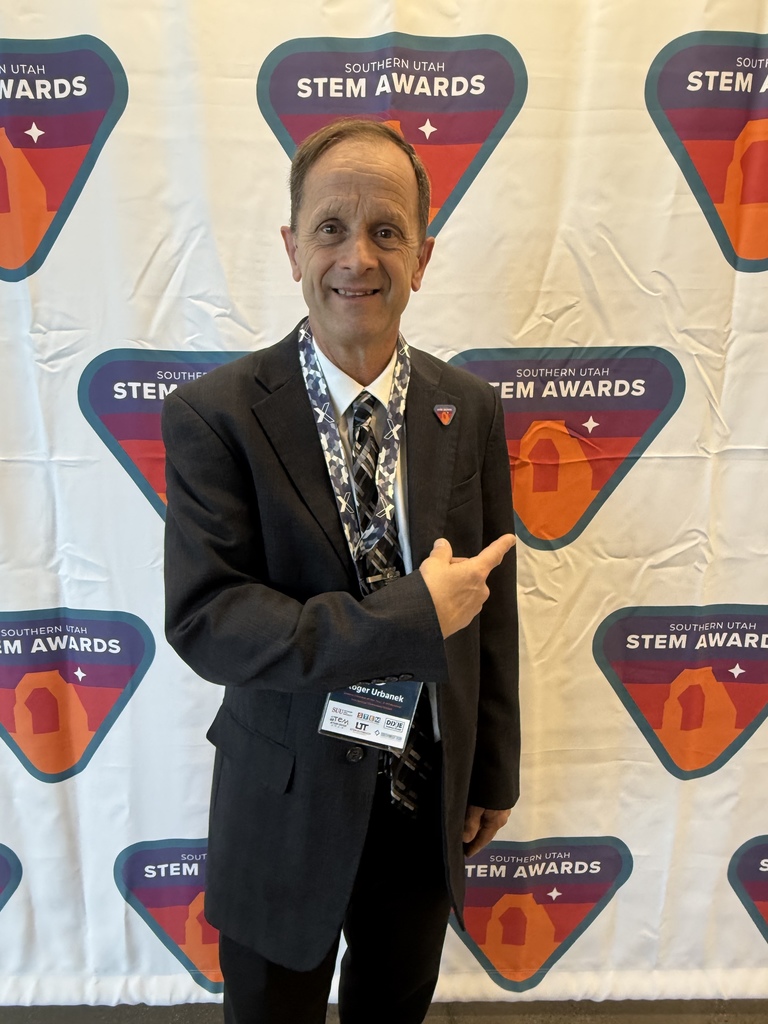 mr urbanek with stem award banner