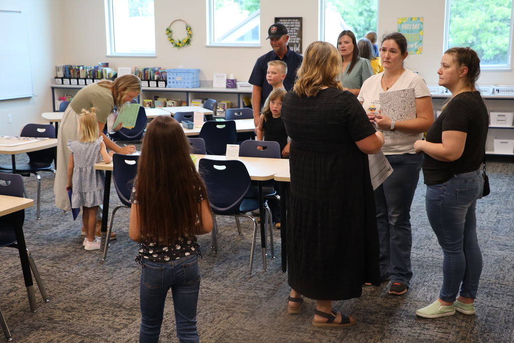 Parents visit with teachers