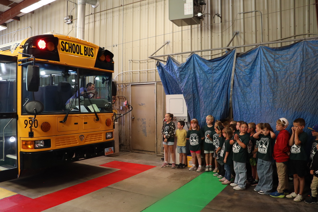 Students wait to move to their next station.