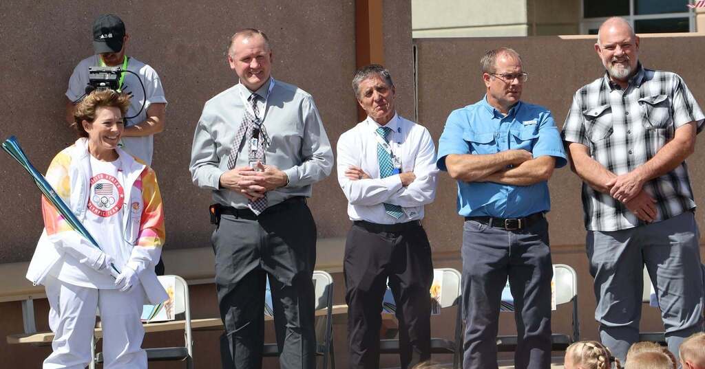 Amy Garff stands next to Superintendent Lance Hatch, Elementary Executive Director Steven Burton, Enoch Mayor Jim Rushton and County Commissioner Mike Blake.