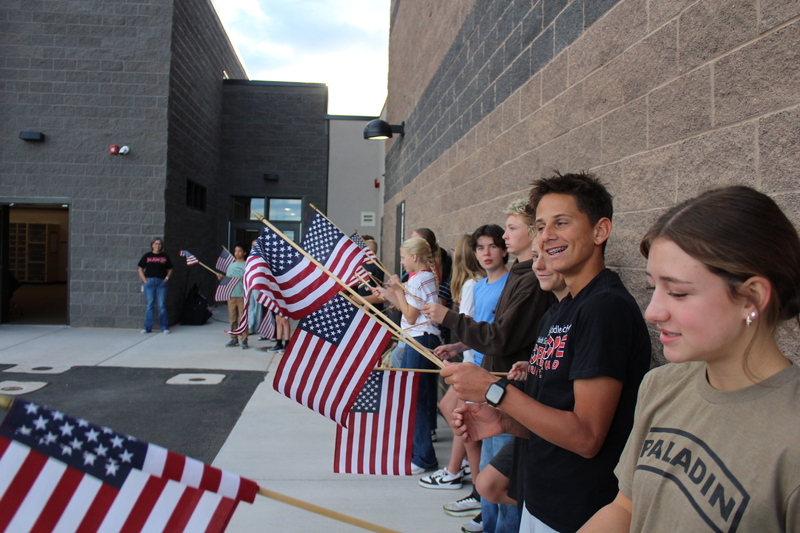 students holding flags