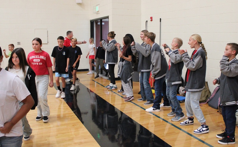 student walking into a gym