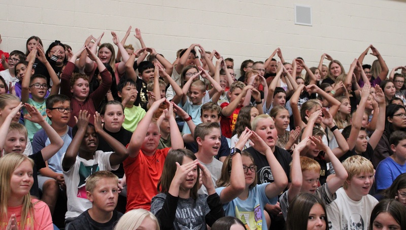 students sitting in bleachers