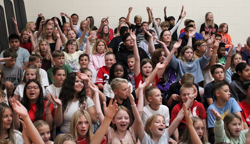 students sitting in bleachers