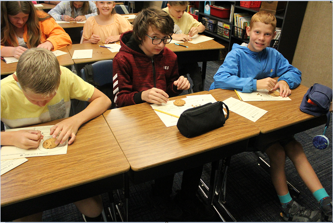 students practicing cookie archeology