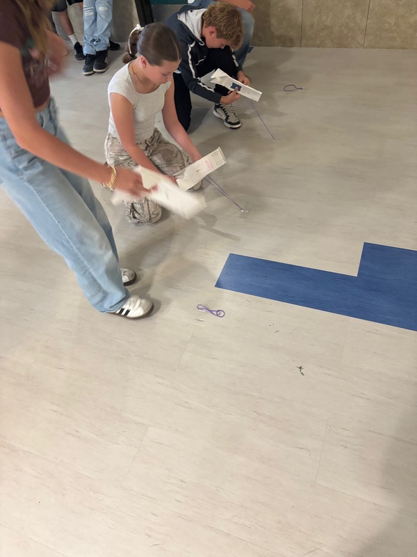 students racing skimmers