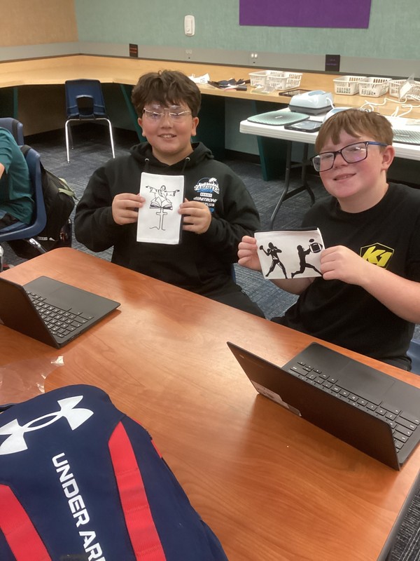 Students showing off pencil bags