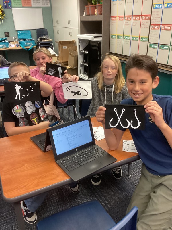 Students showing off pencil bags
