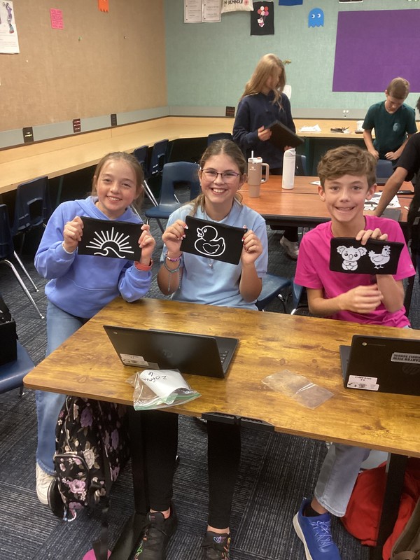 Students showing off pencil bags