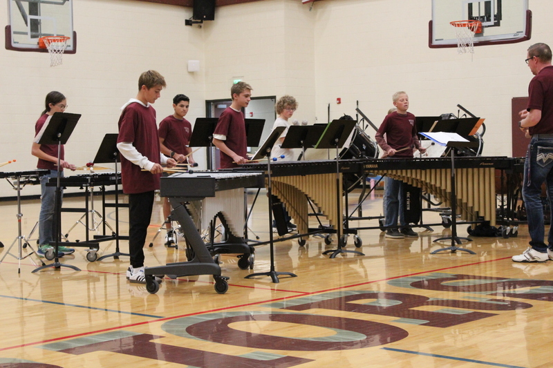 students playing percussion