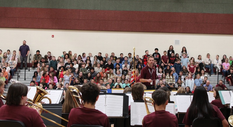 students sitting in bleachers