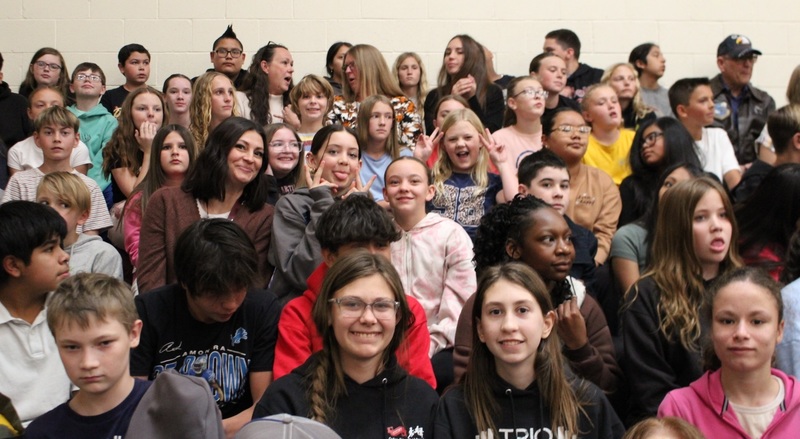 students sitting in bleachers