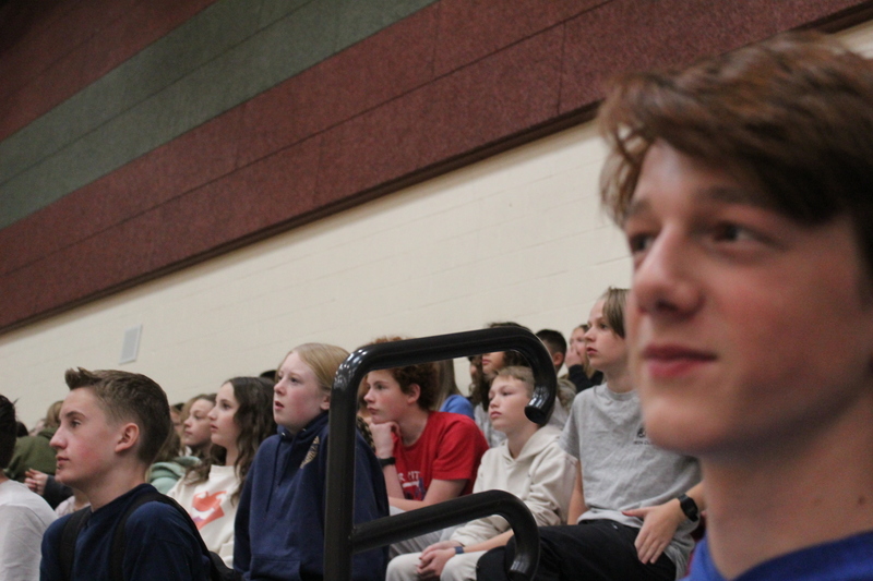 students sitting in bleachers