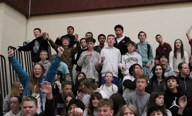 students sitting in bleachers