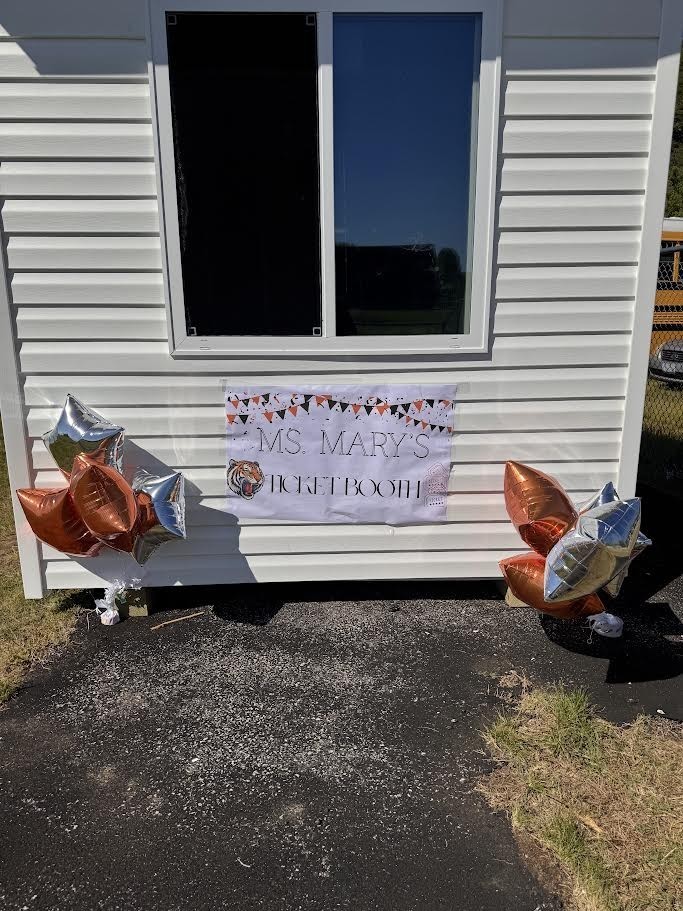 Pictured: Front of ticket booth with sign reading "Ms. Mary's Ticket Booth"