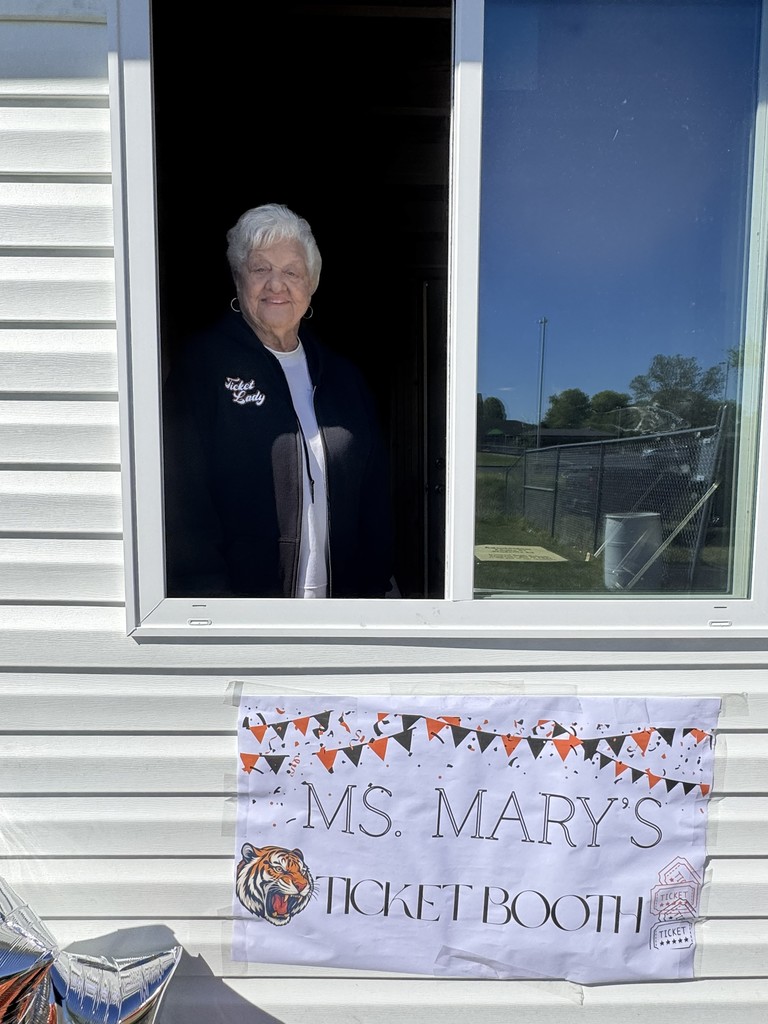 Pictured: Marry Hill in her new ticket booth with a sign reading "Ms. Mary's Ticket Booth"