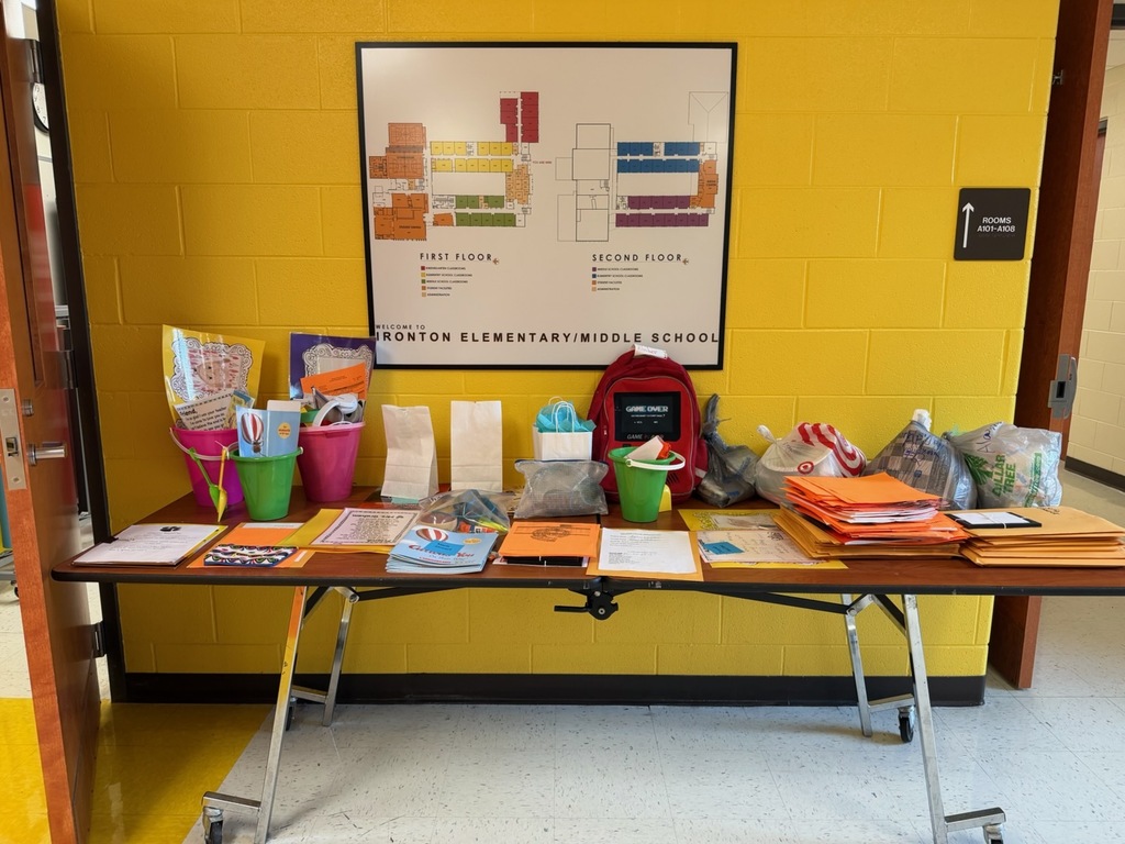Pictured: Desk with assorted schools supplies