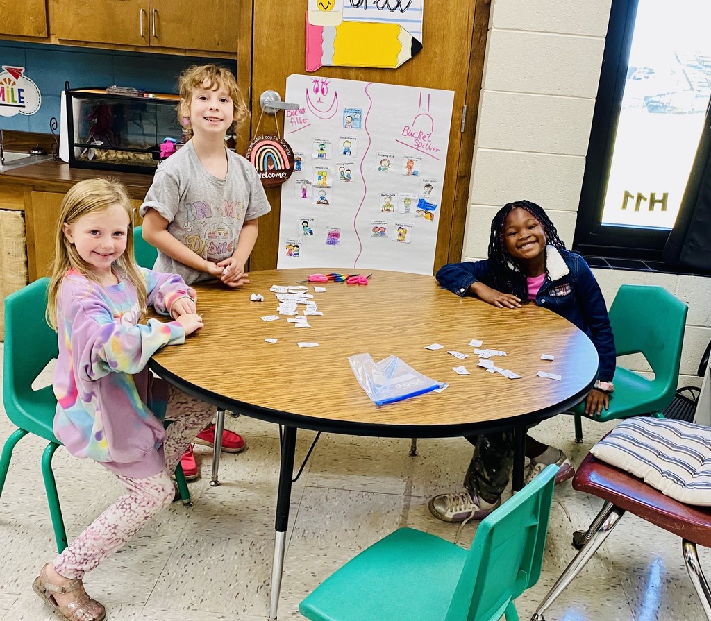 students worked in groups using domino cutouts to explore number combinations