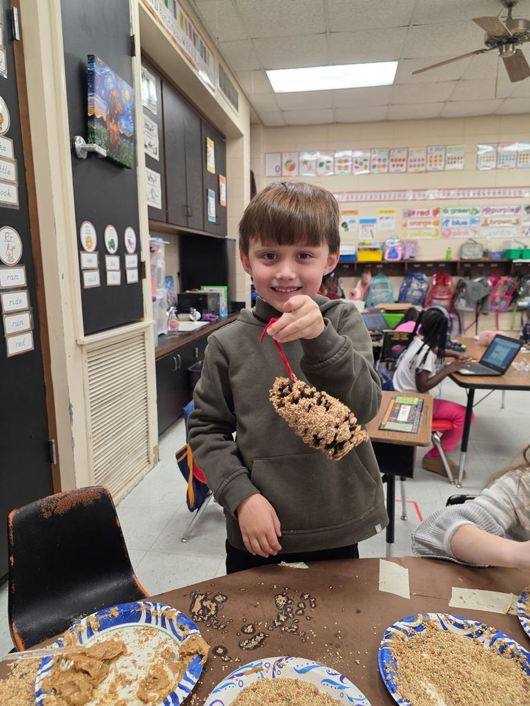 Mrs. Ariel Roberts' class creates pine cone bird feeders