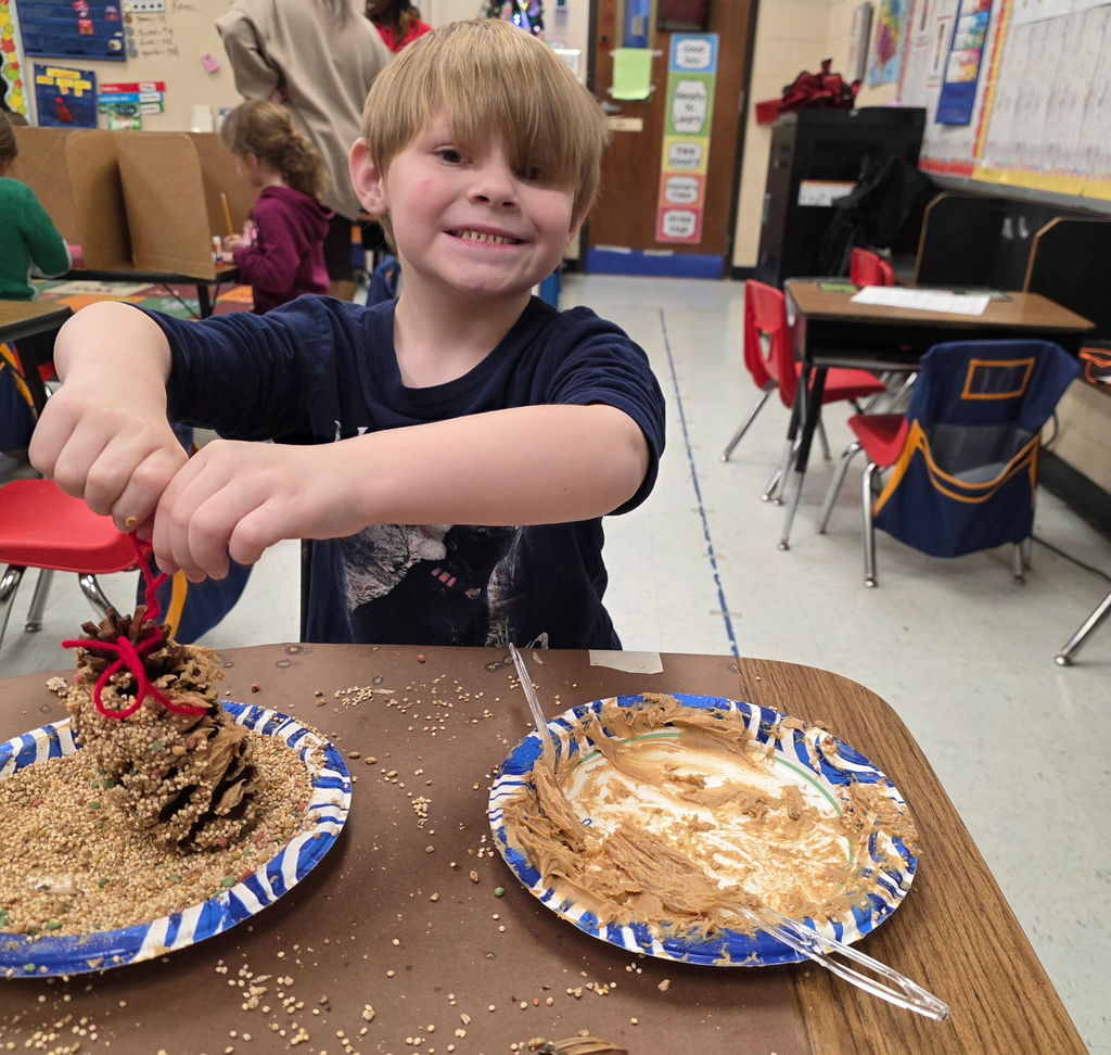 Mrs. Ariel Roberts' class creates pine cone bird feeders