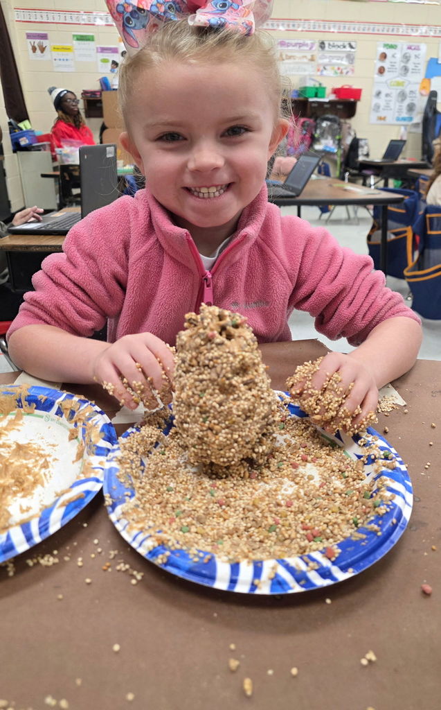 Mrs. Ariel Roberts' class creates pine cone bird feeders