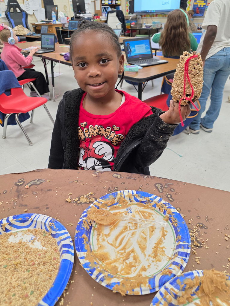 Mrs. Ariel Roberts' class creates pine cone bird feeders