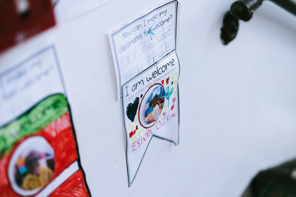 A picture of student artwork that reads "I am welcome."